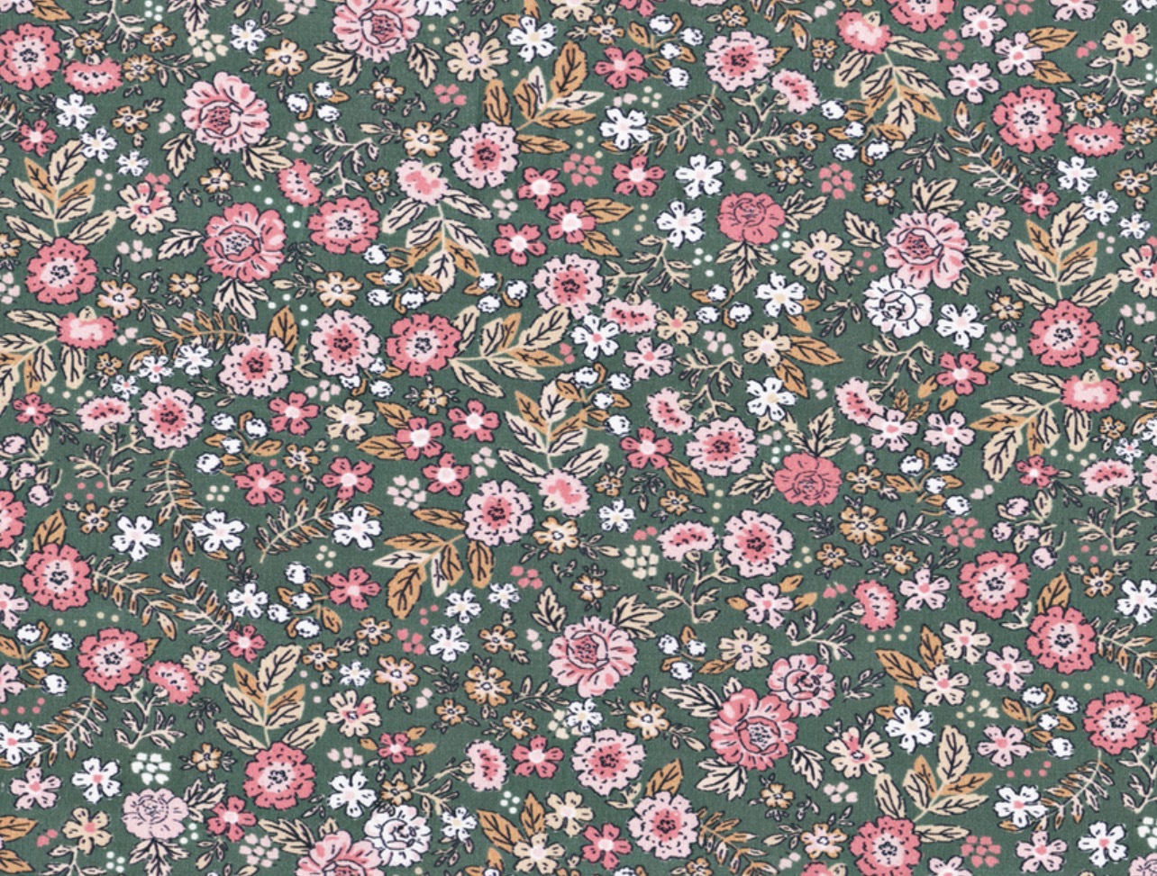Liberty flores pequeñas rosas sobre fondo verde